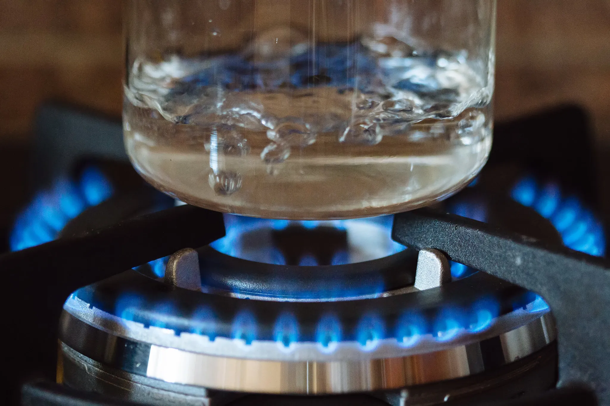 Water being heated on a stove top.